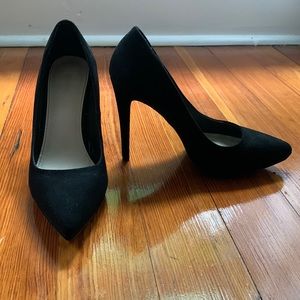 Black pointed toe pumps